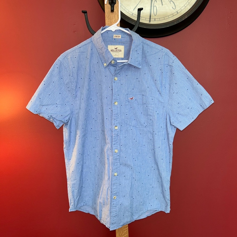 Hollister blue button down polo with a triangle pattern